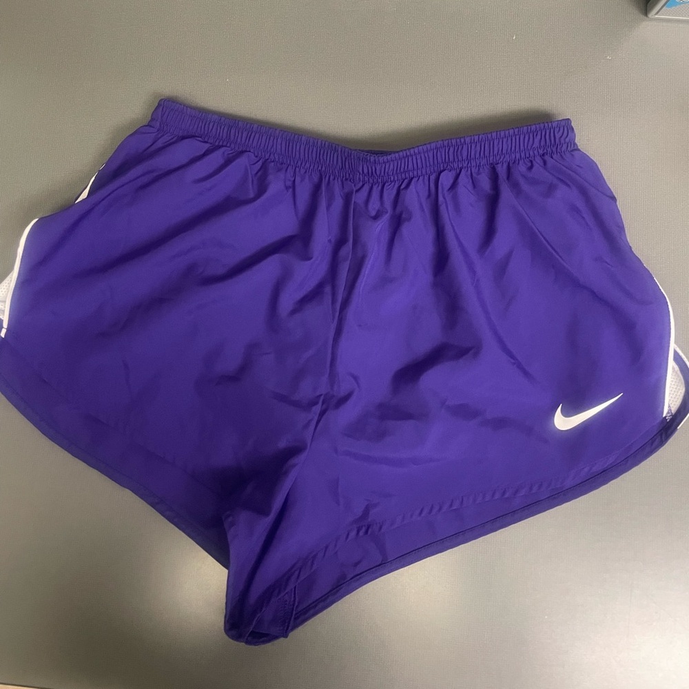Nike Women's Purple Athletic Shorts size large. Lined. Slit sides in white. NWT